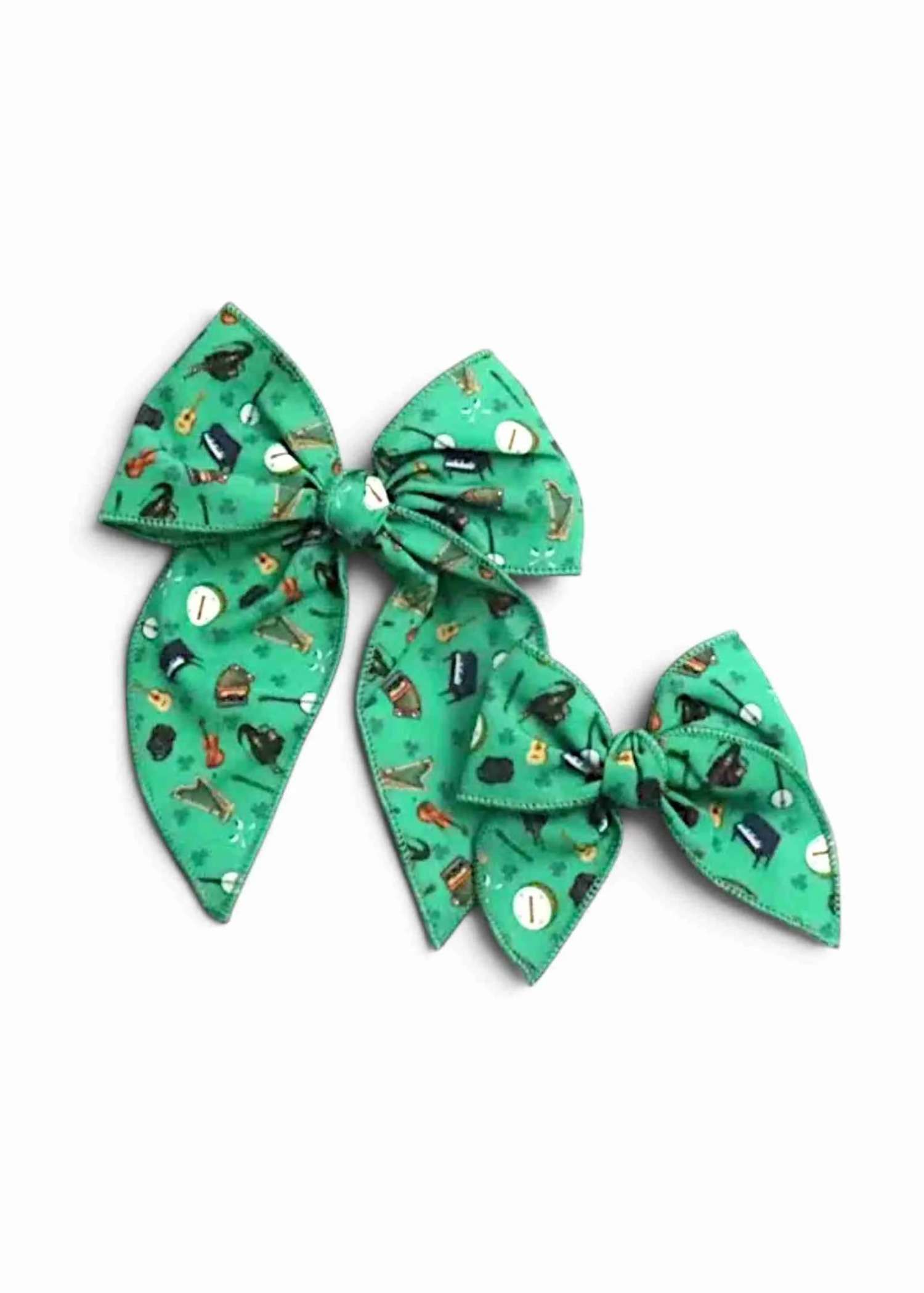 Paws at the Fleadh hair bows with clips in the green print, small and medium sizes shown together